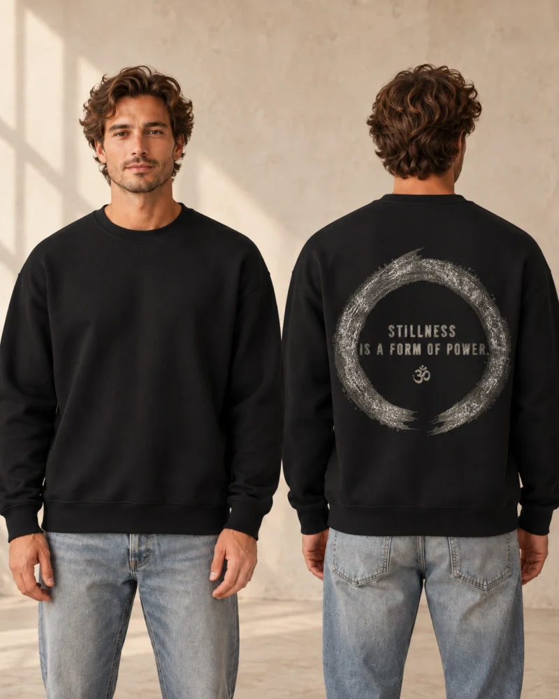 Stillness Is a Form of Power back print on a Black unisex relaxed crewneck, front and back model views