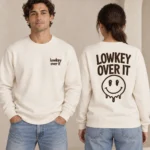 Lowkey Over It unisex relaxed-fit natural raw crewneck sweatshirt, front and back view